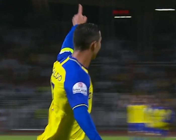 Cristiano Ronaldo pictured celebrating after scoring the fifth goal of his Al Nassr career, during his team's win at Al-Wehda in February 2023